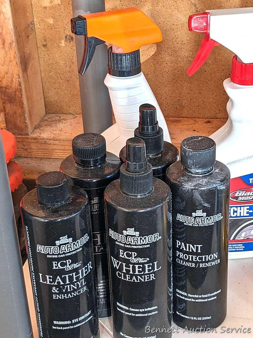Full and partial bottles of automotive cleaners including leather cleaner, scratch out, tire white,