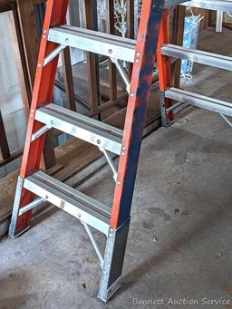 6' fiberglass step ladder is sturdy and in good condition.