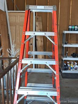 6' fiberglass step ladder is sturdy and in good condition.