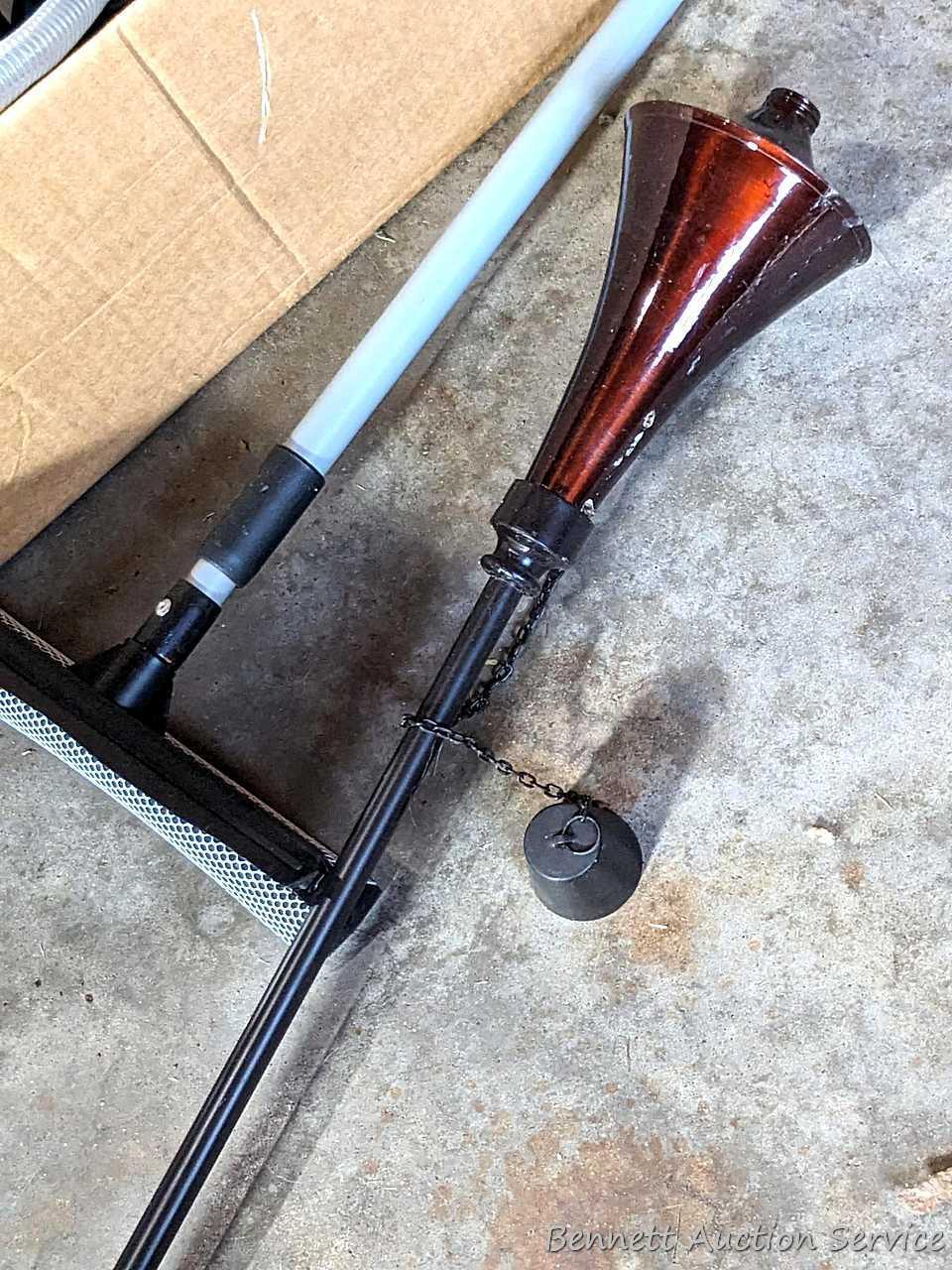 Several bottles of ATV oil, yard torch and fuel, and more.