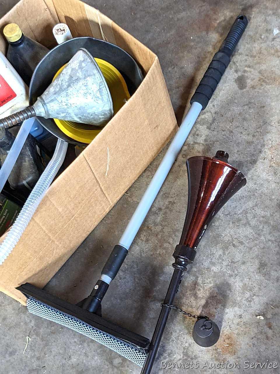 Several bottles of ATV oil, yard torch and fuel, and more.