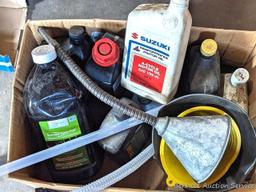 Several bottles of ATV oil, yard torch and fuel, and more.
