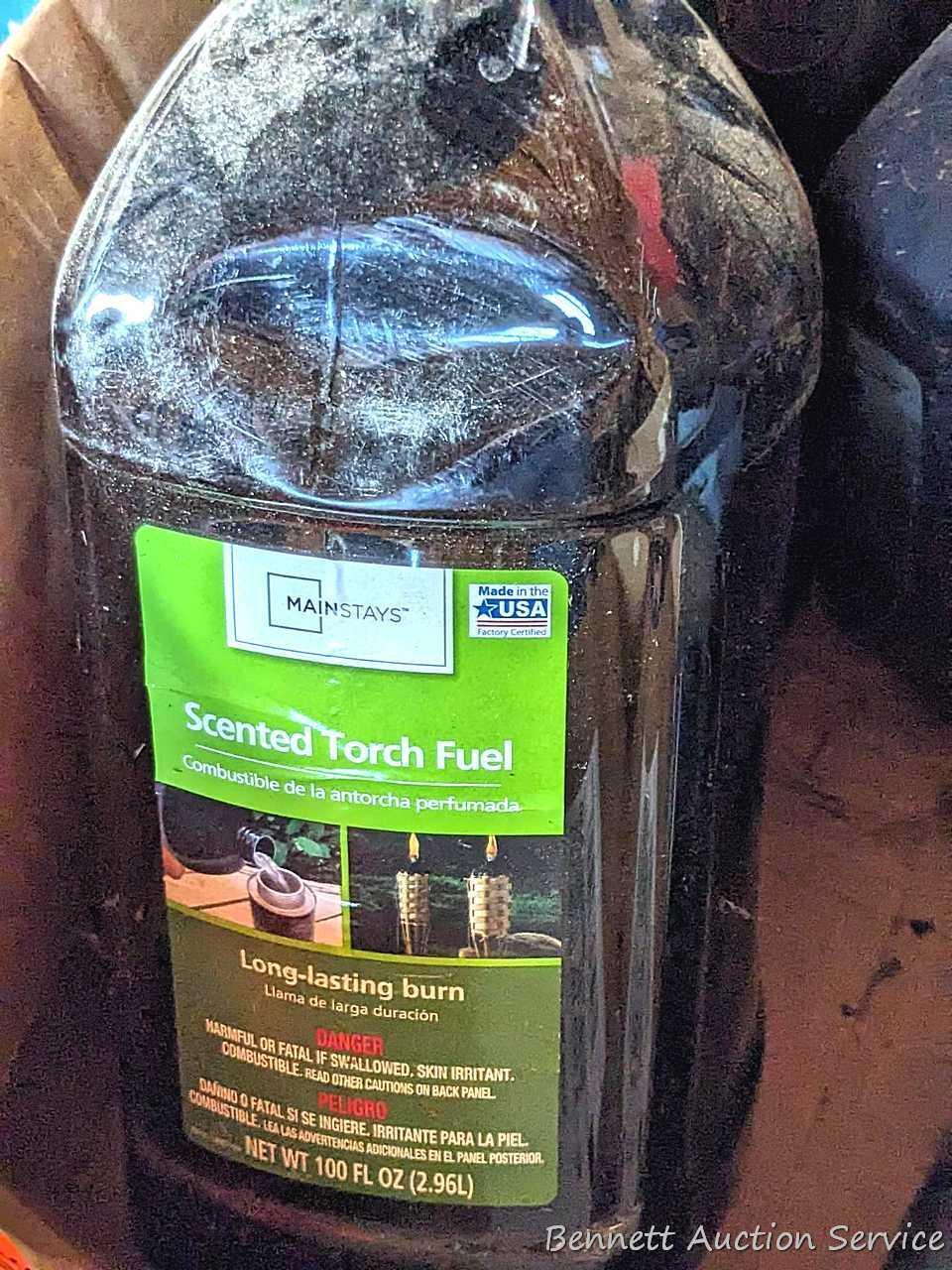 Several bottles of ATV oil, yard torch and fuel, and more.