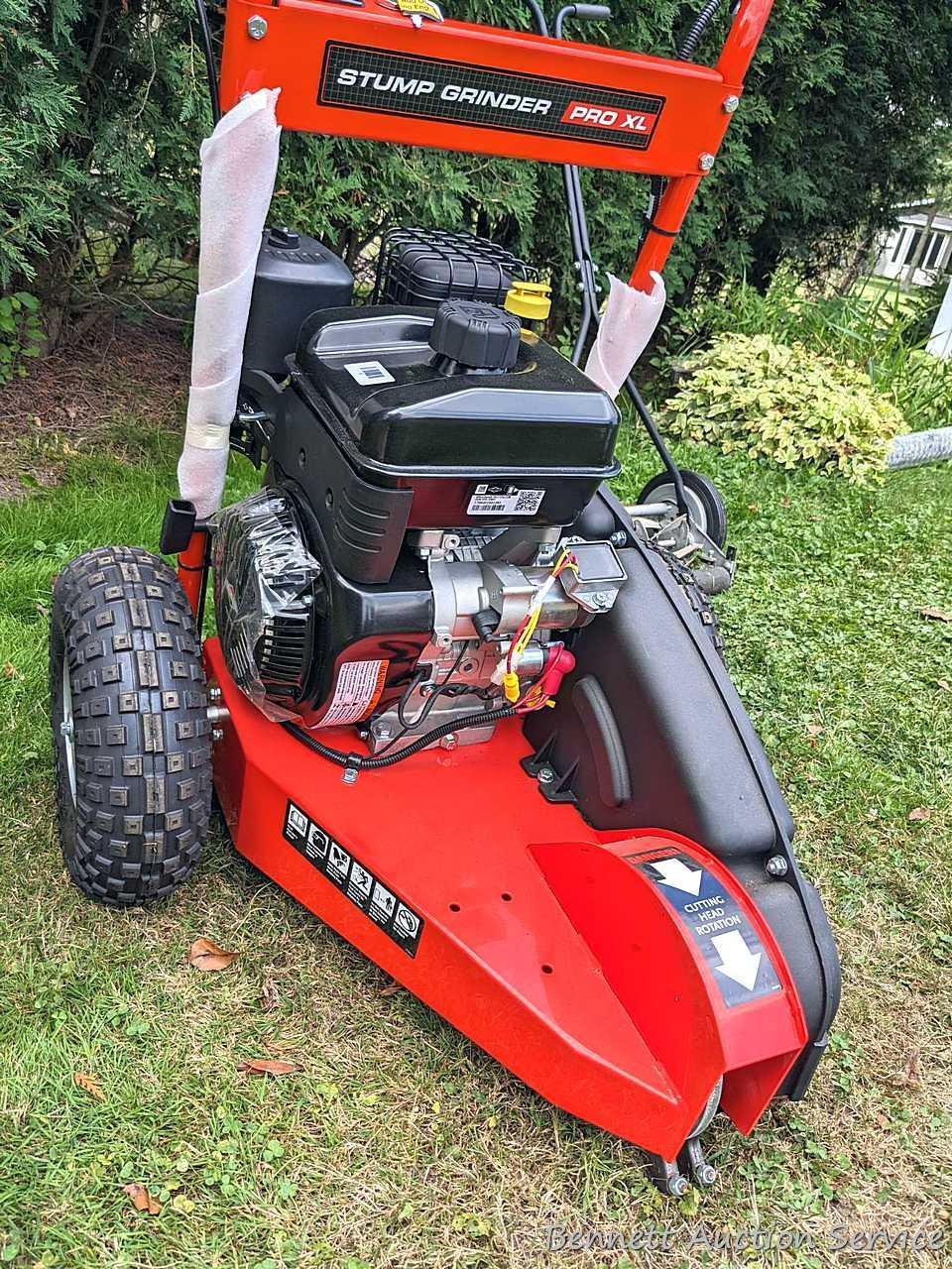 DR Stump Grinder Pro XL comes with manual, battery, oil, wrenches, etc. Appears as-new, as it's not