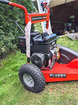 DR Stump Grinder Pro XL comes with manual, battery, oil, wrenches, etc. Appears as-new, as it's not