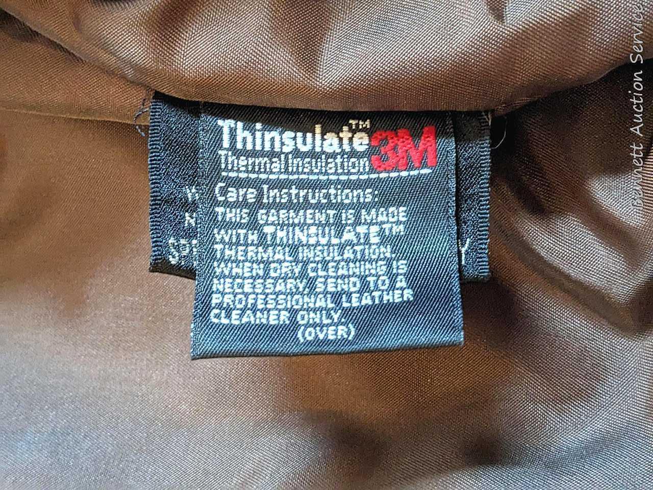 Brown leather jacket by Wilsons is men's size XL and in good condition.
