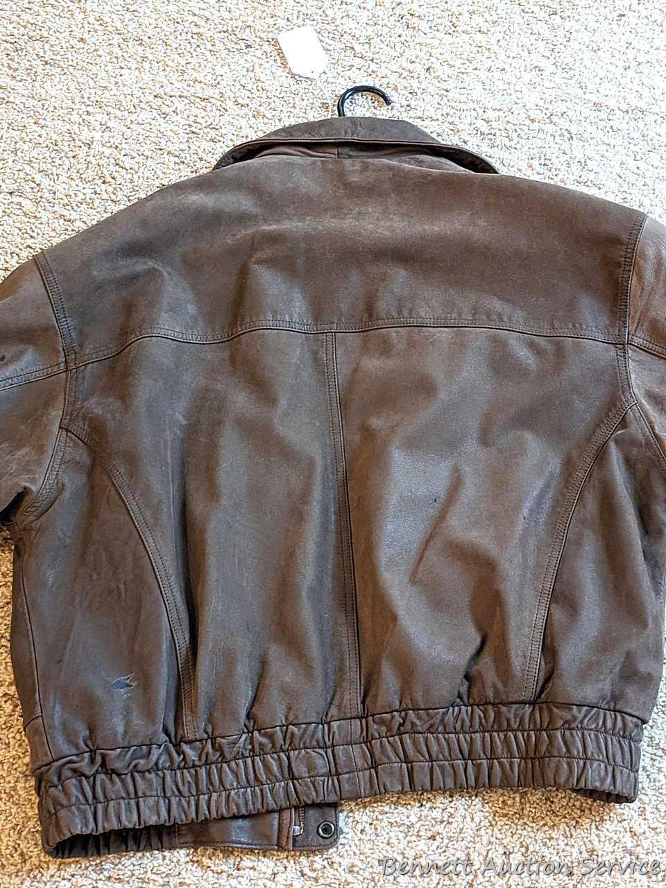 Brown leather jacket by Wilsons is men's size XL and in good condition.