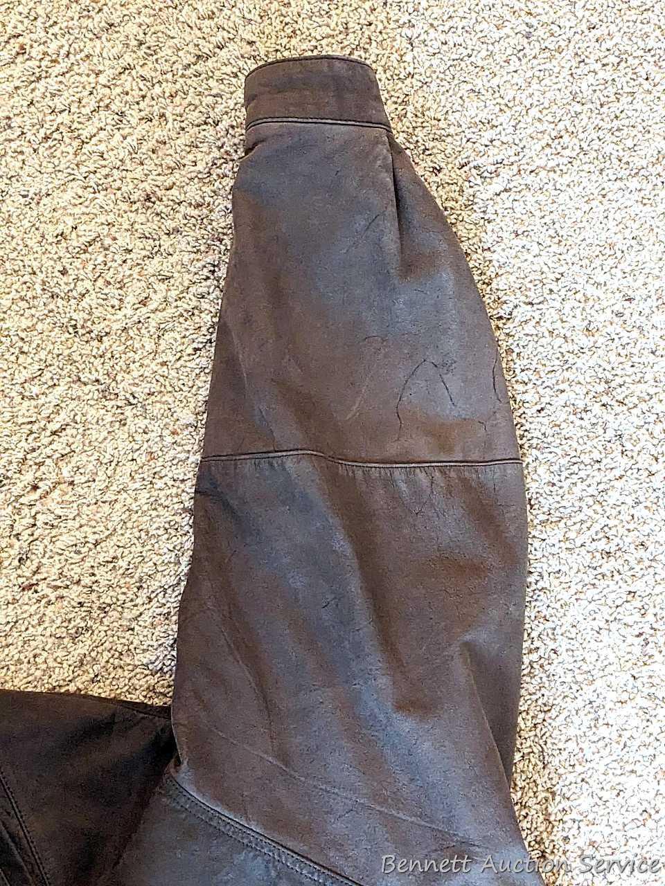 Brown leather jacket by Wilsons is men's size XL and in good condition.
