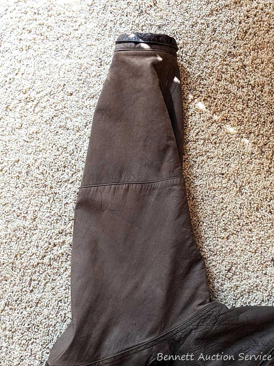 Brown leather jacket by Wilsons is men's size XL and in good condition.