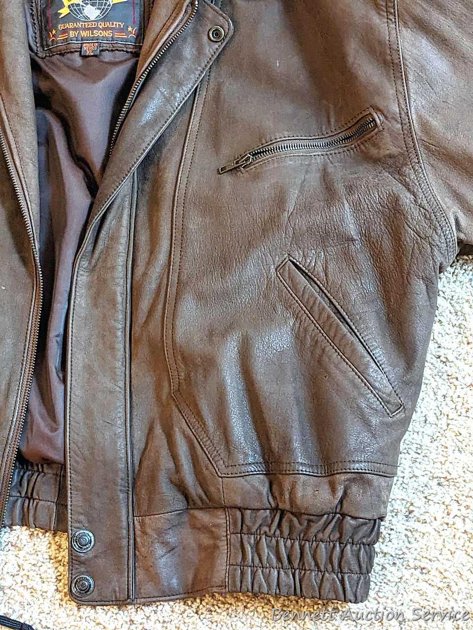 Brown leather jacket by Wilsons is men's size XL and in good condition.