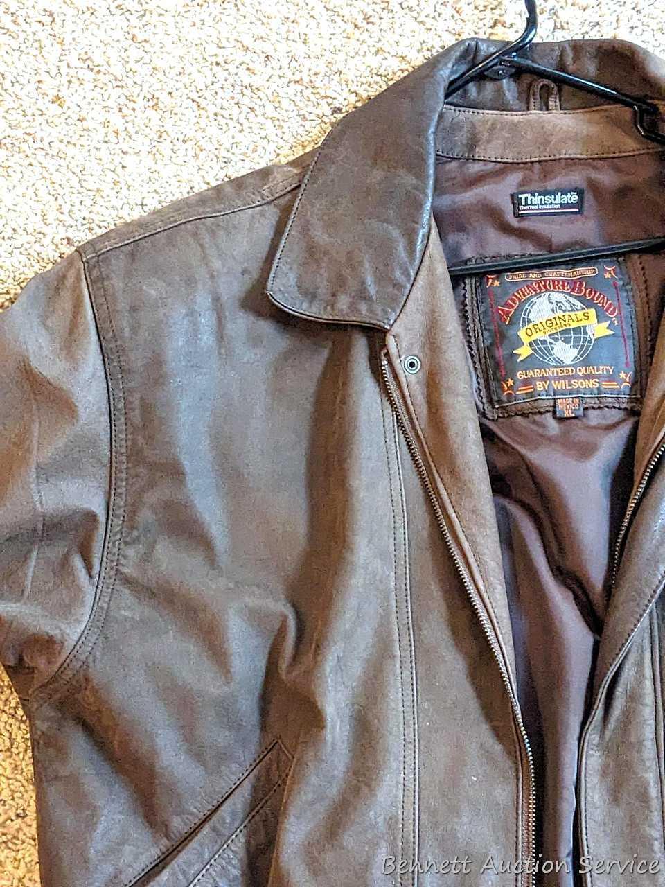Brown leather jacket by Wilsons is men's size XL and in good condition.