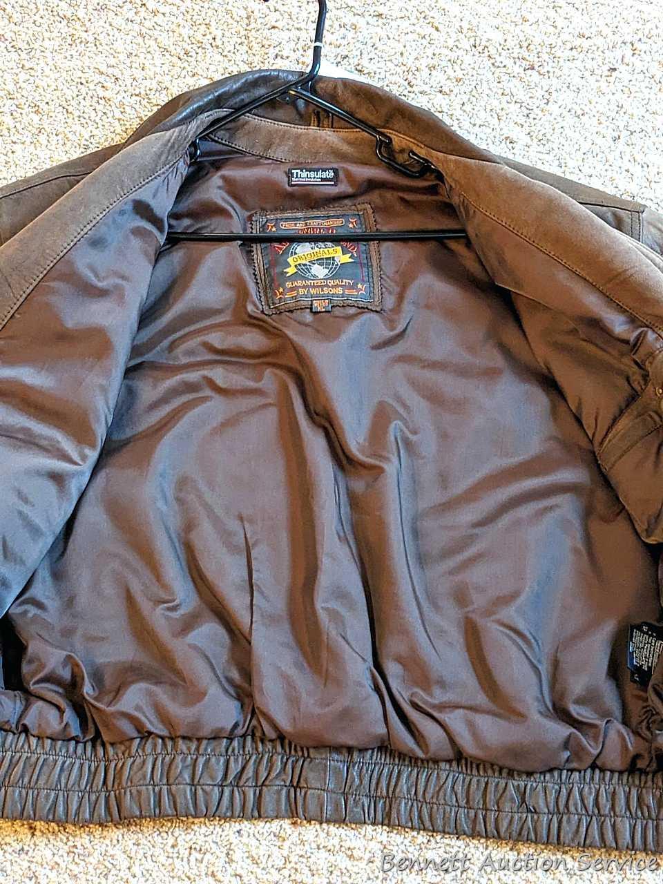 Brown leather jacket by Wilsons is men's size XL and in good condition.