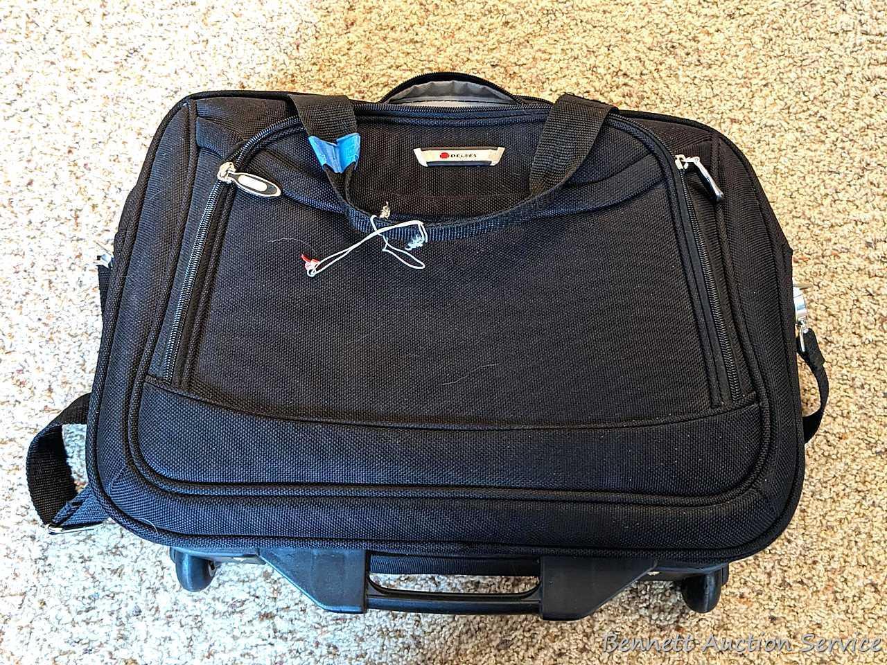 Two American Tourister carry on bags, plus another with wheels for easy travel; Also a tote bag and