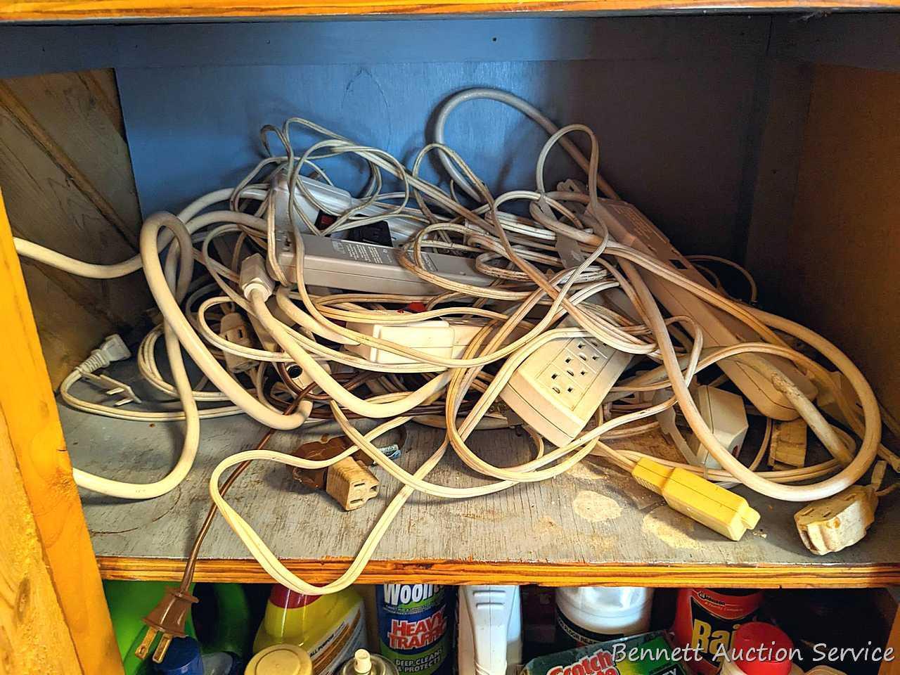 2 shelves of extension cords, power strips, various light bulbs, and more.