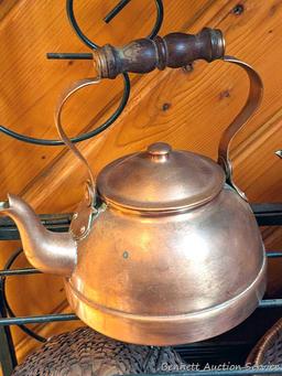 Pair of copper colored tea kettles with wooden handles. Measure 8" over handle and are in good