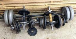 Cast iron and other free weights, plus dumb bell bars and a bench press bar.