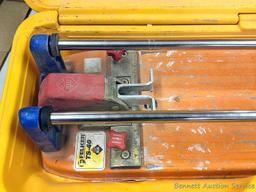 Felker TS-40 Rubi tile cutter is nearly 2' long and comes with assorted cutters, fence and hard