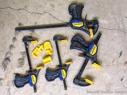 Four Quick-Grip bar clamps, largest measures 20" long.