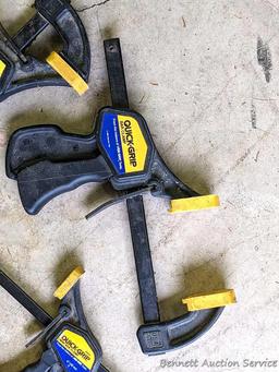 Four Quick-Grip bar clamps, largest measures 20" long.