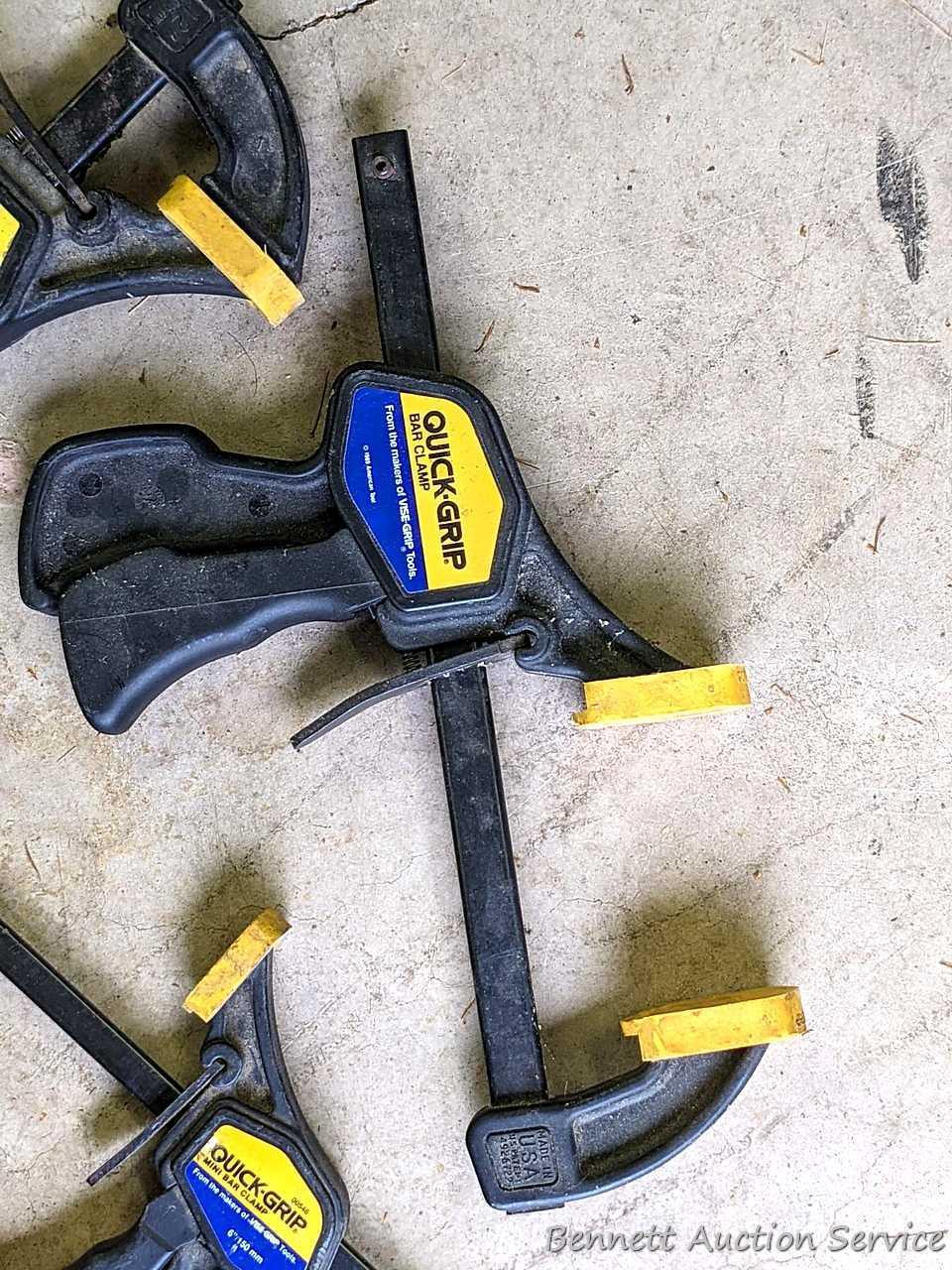 Four Quick-Grip bar clamps, largest measures 20" long.