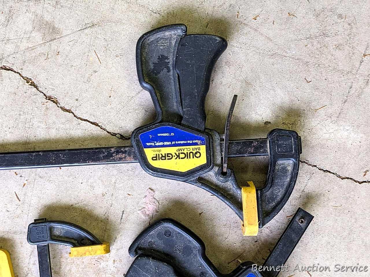 Four Quick-Grip bar clamps, largest measures 20" long.