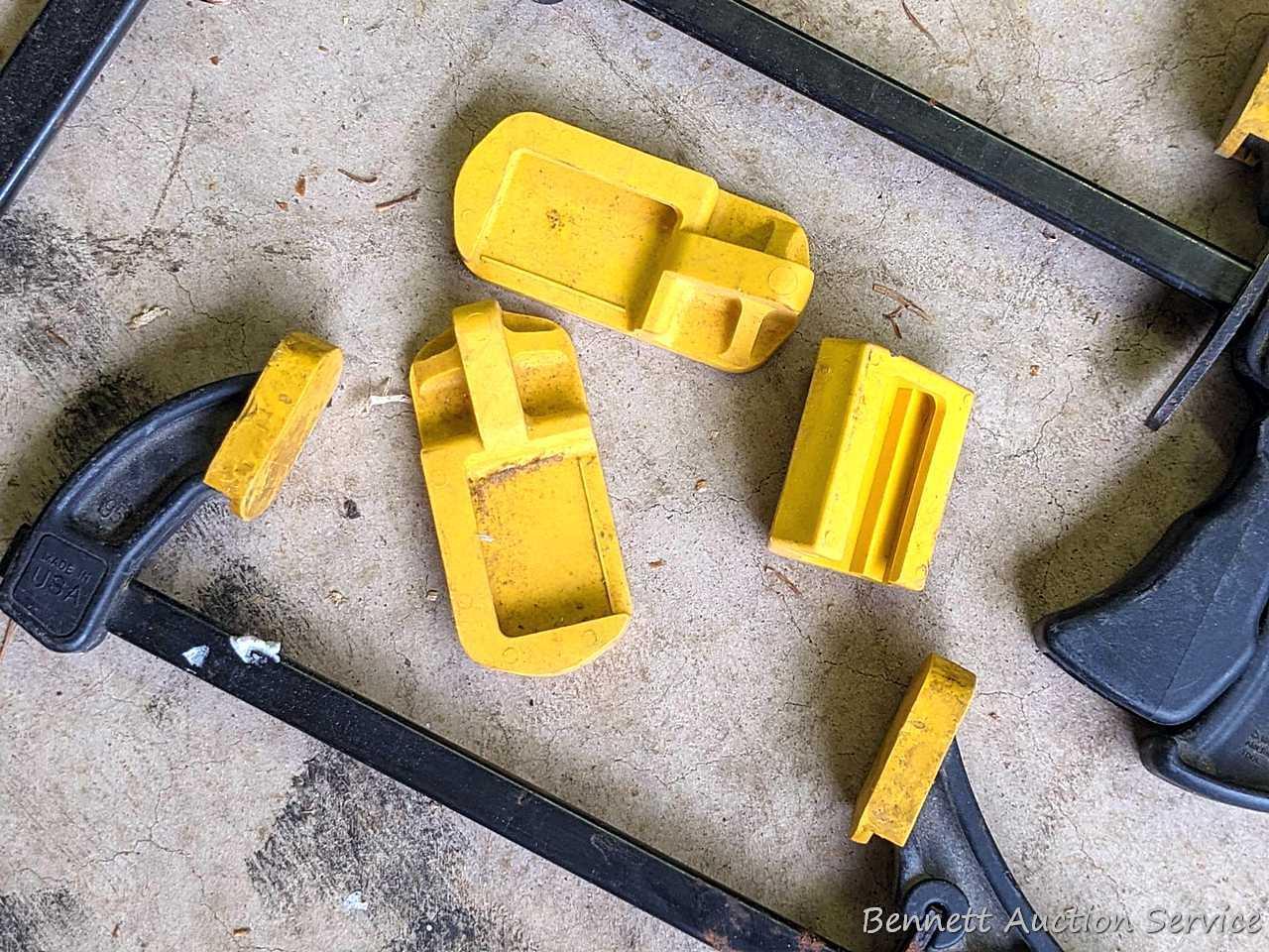 Four Quick-Grip bar clamps, largest measures 20" long.
