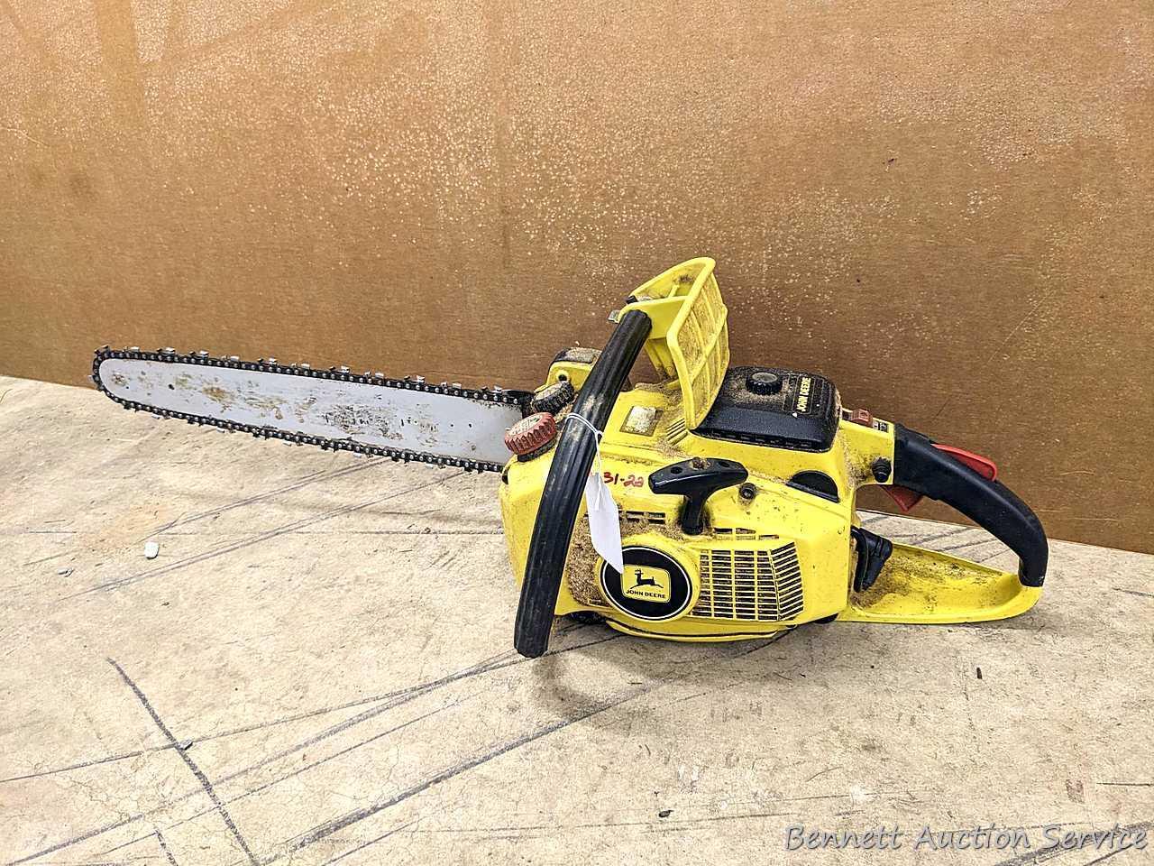John Deere chainsaw with 20" roller tip bar and a near-new saw chain. Pulls over and has snappy