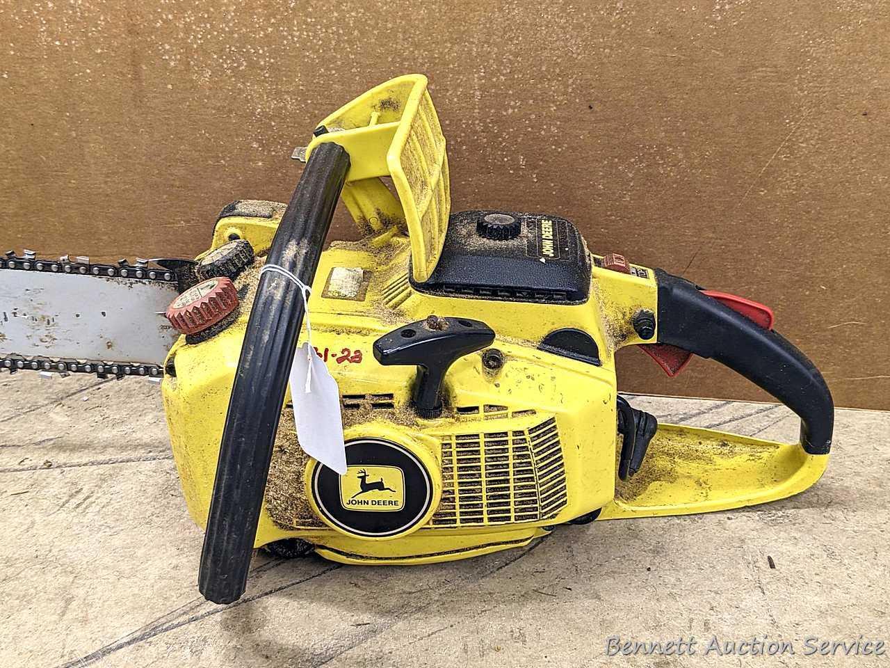 John Deere chainsaw with 20" roller tip bar and a near-new saw chain. Pulls over and has snappy