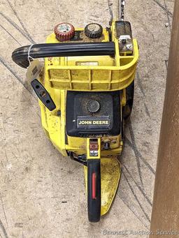 John Deere chainsaw with 20" roller tip bar and a near-new saw chain. Pulls over and has snappy
