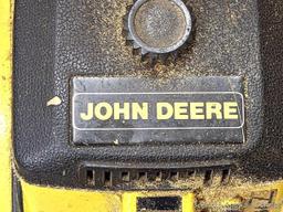 John Deere chainsaw with 20" roller tip bar and a near-new saw chain. Pulls over and has snappy
