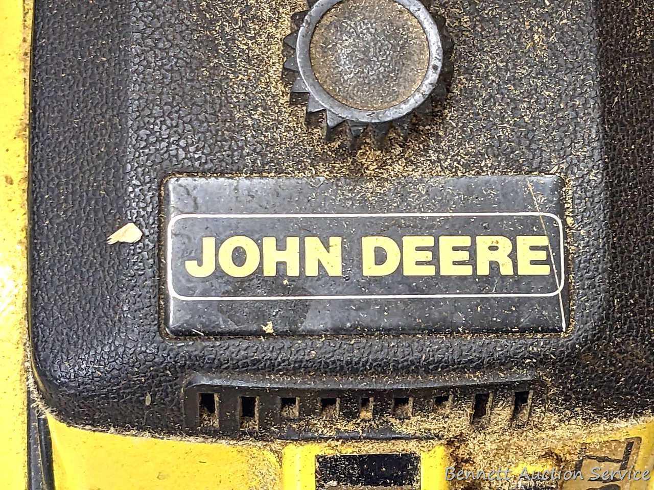 John Deere chainsaw with 20" roller tip bar and a near-new saw chain. Pulls over and has snappy