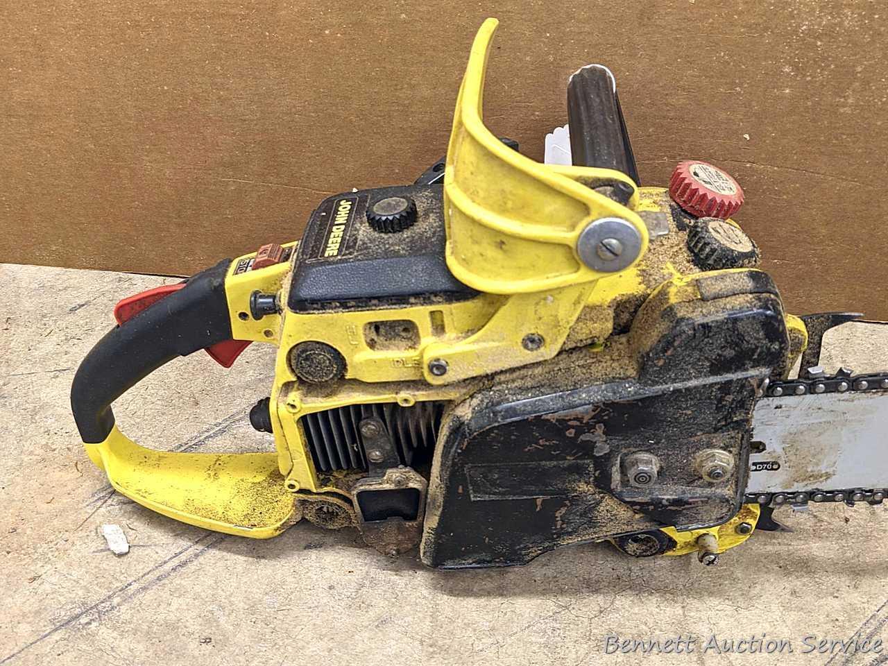 John Deere chainsaw with 20" roller tip bar and a near-new saw chain. Pulls over and has snappy