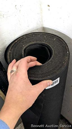 Roll of 36" tar paper and partial roll of house wrap.