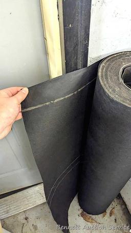 Roll of 36" tar paper and partial roll of house wrap.