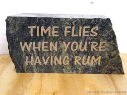 9" marble drinking sign reads Time Flies When You're Having Rum. In good condition.