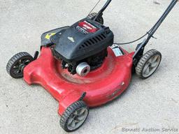 Yard Machines lawn mower with a 22" cut and a 4 HP Brigs and Stratton engine. The mower fired right