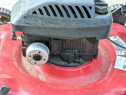 Yard Machines lawn mower with a 22" cut and a 4 HP Brigs and Stratton engine. The mower fired right