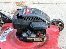 Yard Machines lawn mower with a 22" cut and a 4 HP Brigs and Stratton engine. The mower fired right