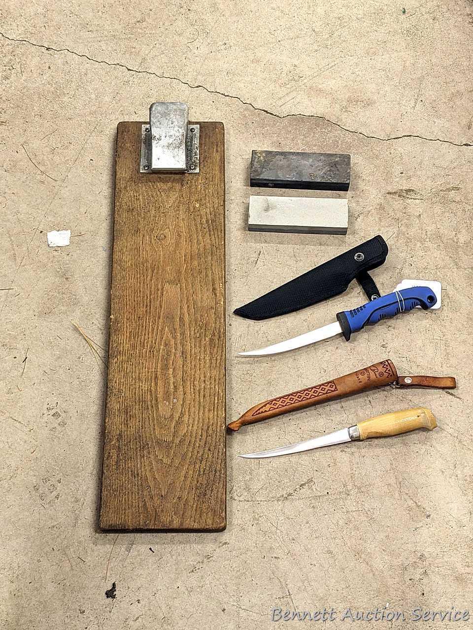Rapala J. Marttiini stainless 11" filet knife; other 12" filet knife; two 6" sharpening stones and a