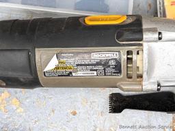 Rockwell SoniCrafter trim saw in bag and includes a variety of blades. Some blades appear to be