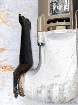 Rockwell SoniCrafter trim saw in bag and includes a variety of blades. Some blades appear to be