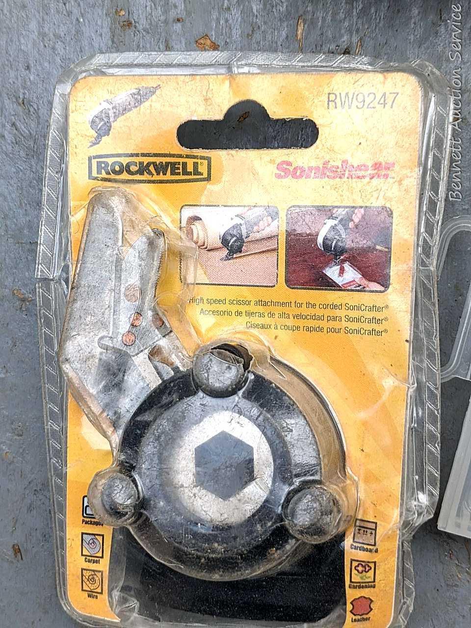 Rockwell SoniCrafter trim saw in bag and includes a variety of blades. Some blades appear to be