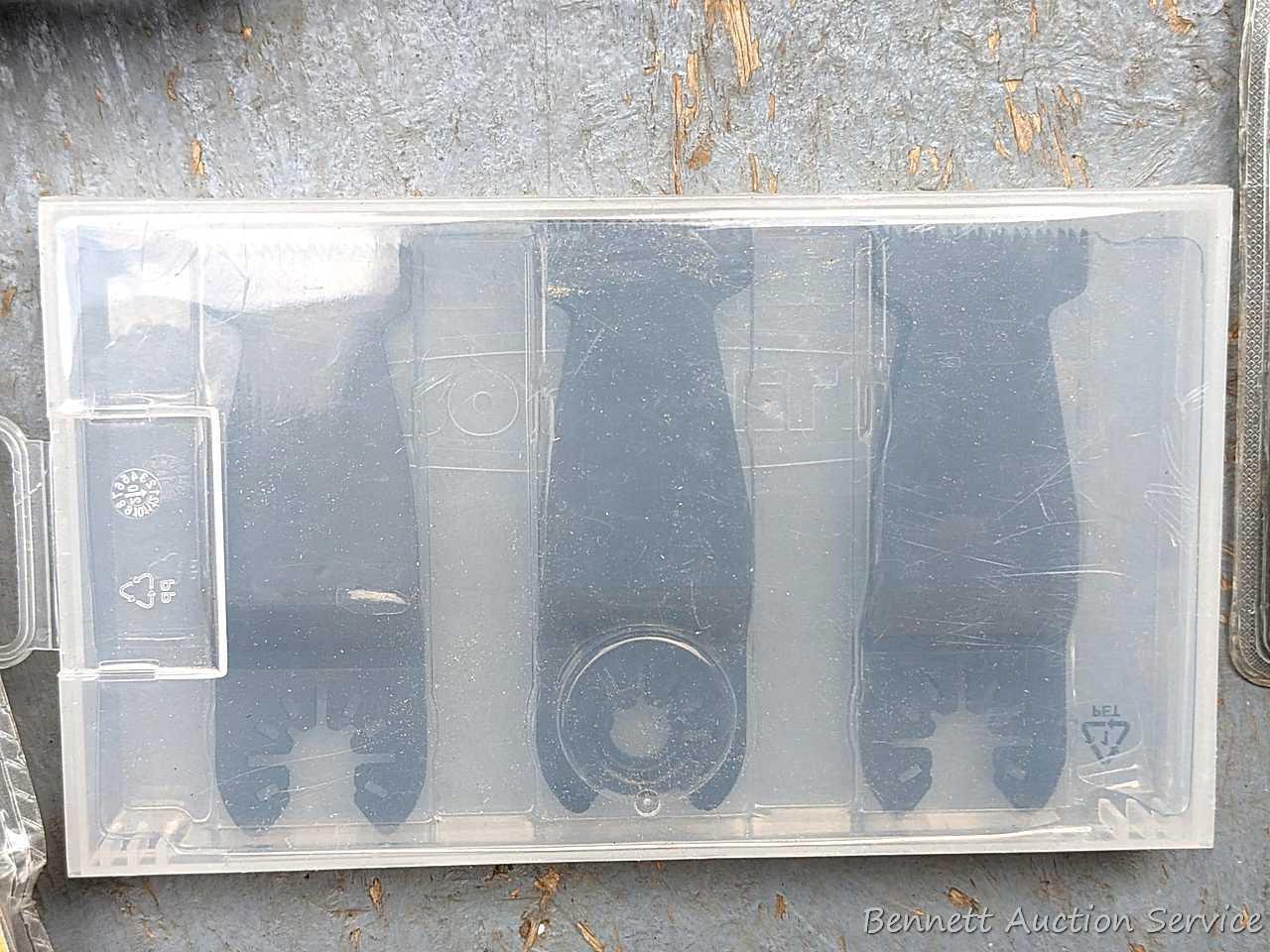 Rockwell SoniCrafter trim saw in bag and includes a variety of blades. Some blades appear to be