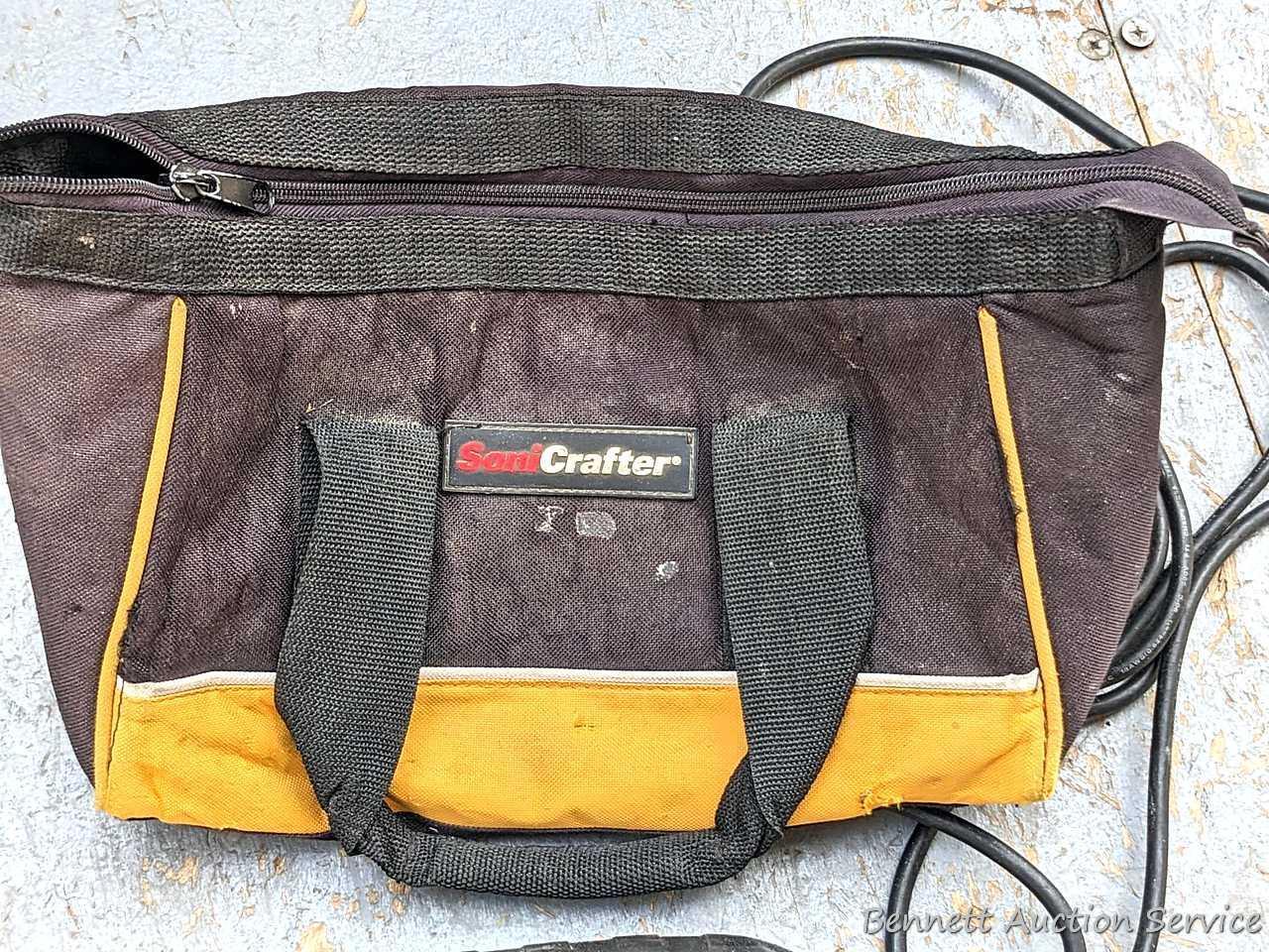 Rockwell SoniCrafter trim saw in bag and includes a variety of blades. Some blades appear to be