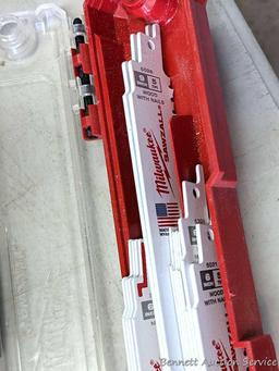 New and used Milwaukee reciprocating saw blades, mostly demolition blades.