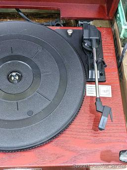 Pickup in Rib Lake. Anders Nicholson record turntable is Model TR-W155. Runs. About 15" wide. Wipe