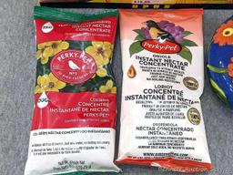 1 oriole feeder and 1 hummingbird feeder; 2 packages of instant nectar concentrate, one for orioles