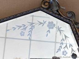 Pretty antique buffet mirror has etched flowers on glass and beveled edges. Measures about 46" x 17"