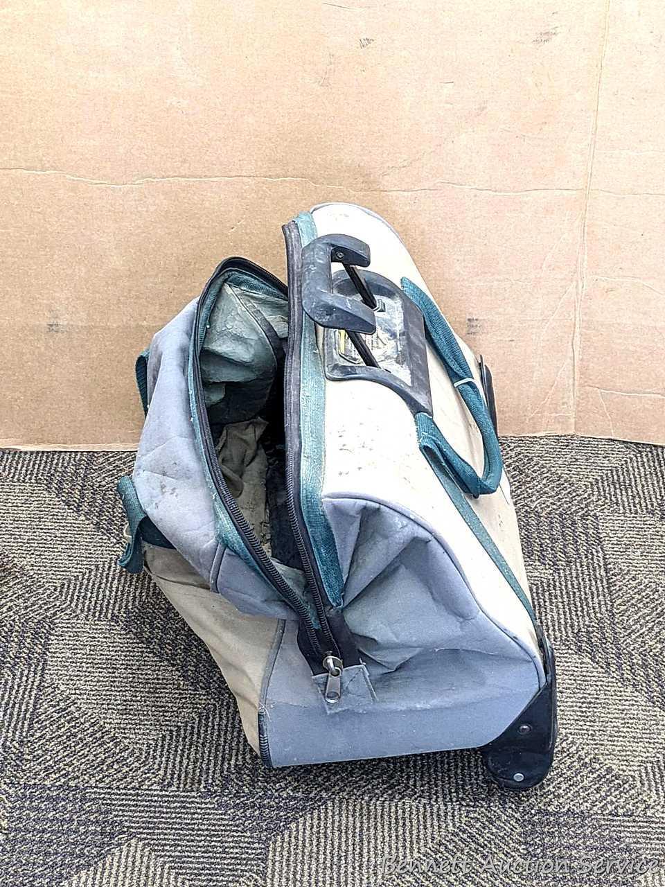 20" Storehouse rolling tool bag is in overall good condition, clean it up or use as-is. About 10"