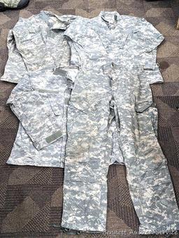 US Military Army digital camouflage combat uniform and two extra coats of the same type. All coats